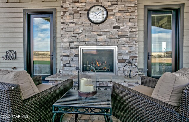 view of patio / terrace featuring an outdoor living space, a ceiling fan, and area for grilling