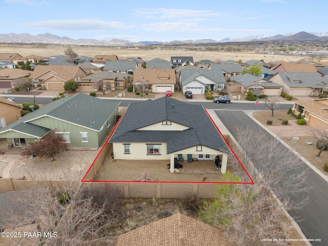 birds eye view of property featuring a residential view and a mountain view