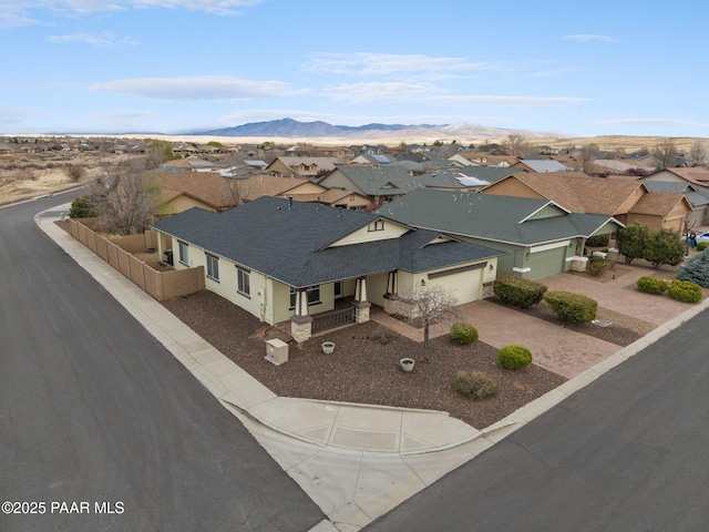birds eye view of property with a residential view and a mountain view