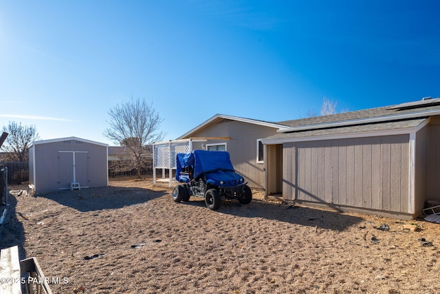 exterior space featuring a storage shed and an outbuilding