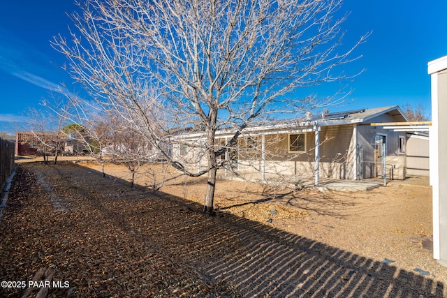 view of yard featuring fence and a patio area