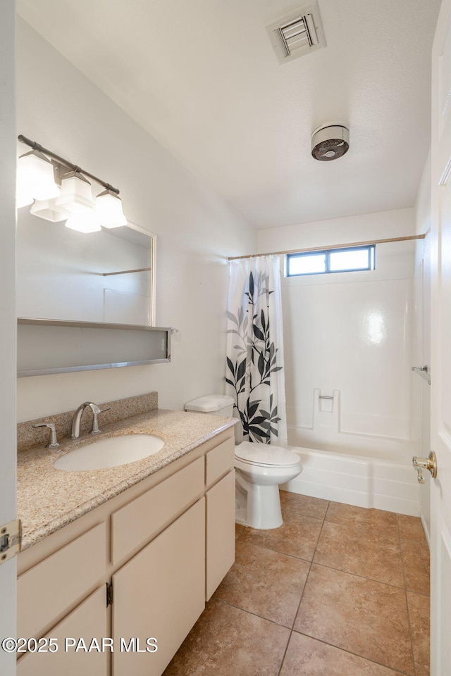 full bathroom featuring tile patterned flooring, visible vents, toilet, shower / tub combo, and vanity