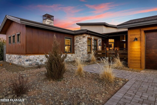 view of back house at dusk