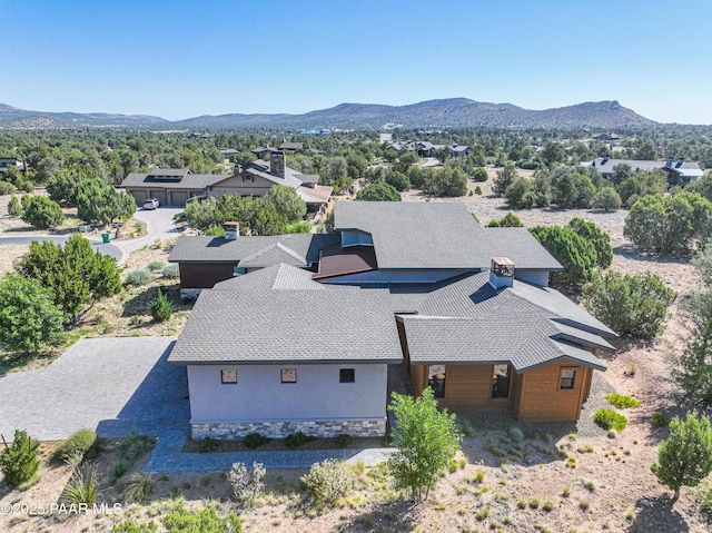 birds eye view of property featuring a mountain view