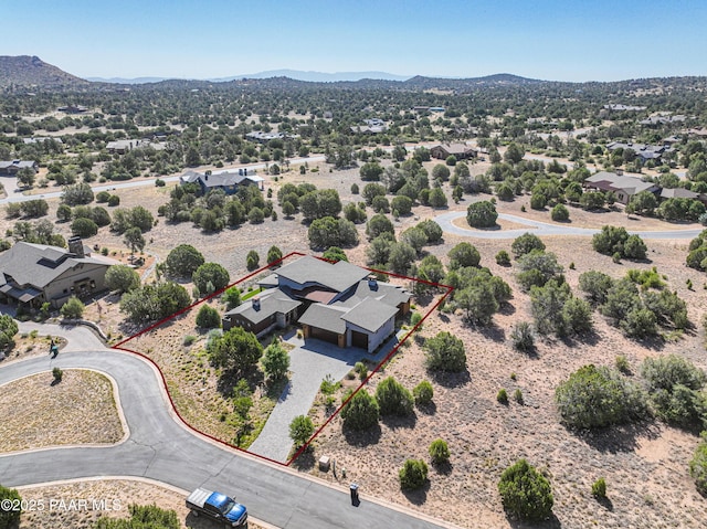 birds eye view of property featuring a mountain view