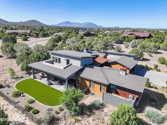 birds eye view of property with a mountain view