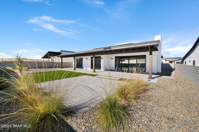 rear view of house featuring a patio area