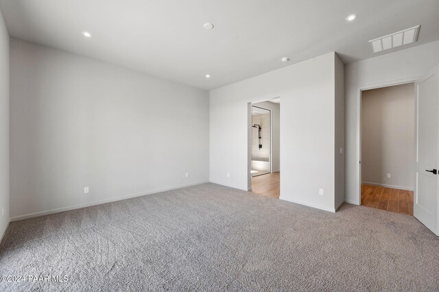 unfurnished bedroom with light carpet