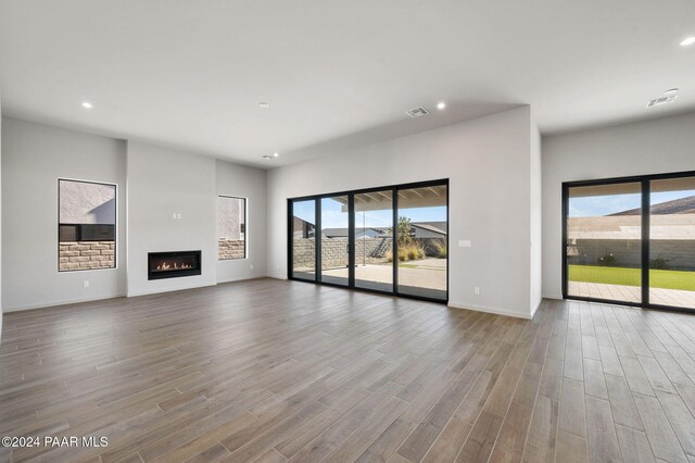 unfurnished living room featuring hardwood / wood-style floors