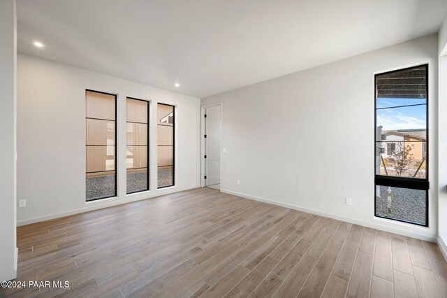 unfurnished room featuring light wood-type flooring