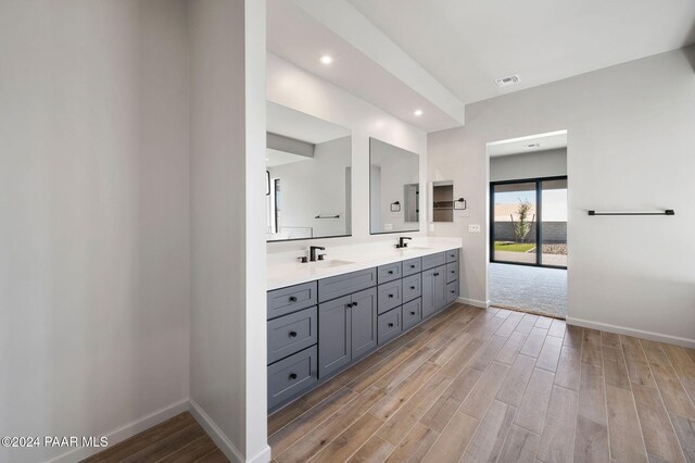 bathroom featuring vanity and hardwood / wood-style flooring