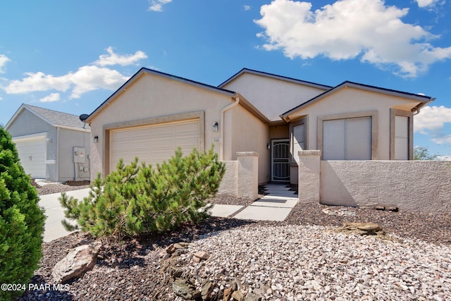 ranch-style home featuring a garage