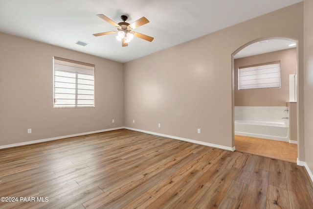 spare room with ceiling fan and light hardwood / wood-style flooring