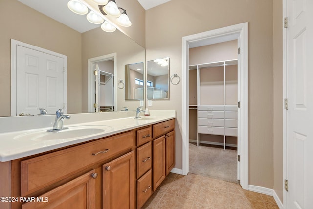 bathroom featuring tile patterned flooring and vanity