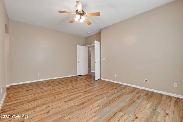 spare room with ceiling fan and light hardwood / wood-style flooring