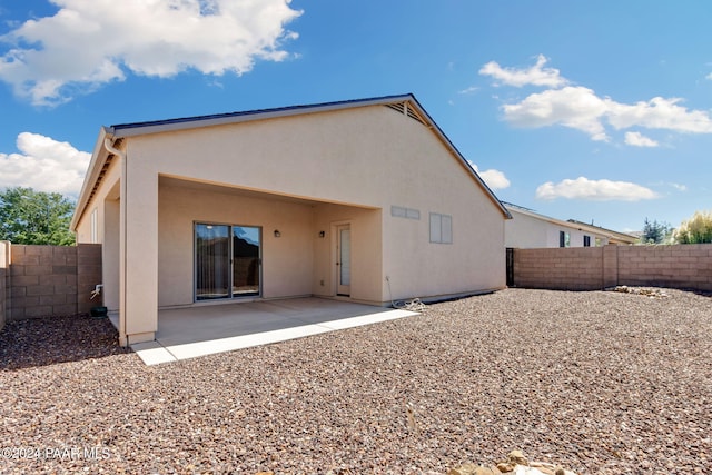 back of house with a patio