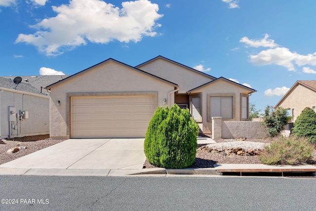 ranch-style home featuring a garage