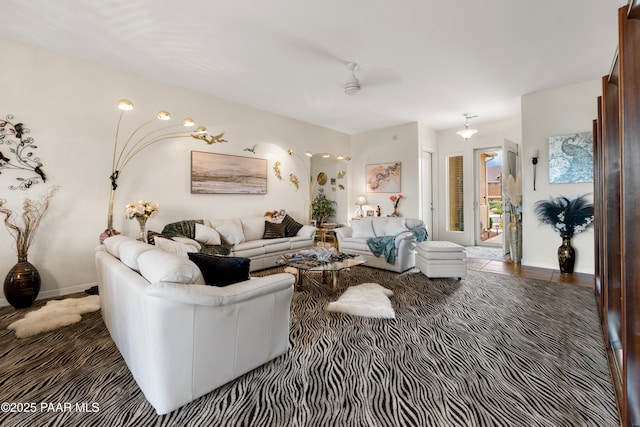 living room with baseboards and carpet floors