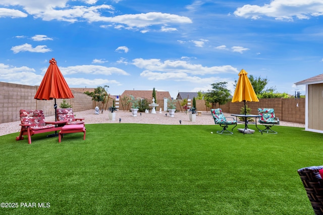 view of yard with a fenced backyard