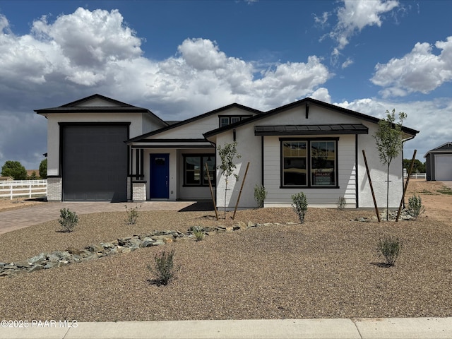 2535 Dillon Blvd, Chino Valley, AZ 86323 - view of front of house with an attached garage, driveway, and stucco siding