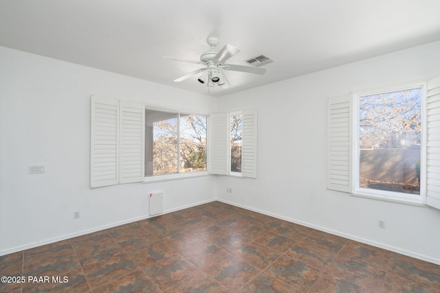 empty room featuring ceiling fan