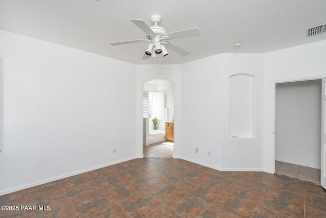 spare room featuring ceiling fan