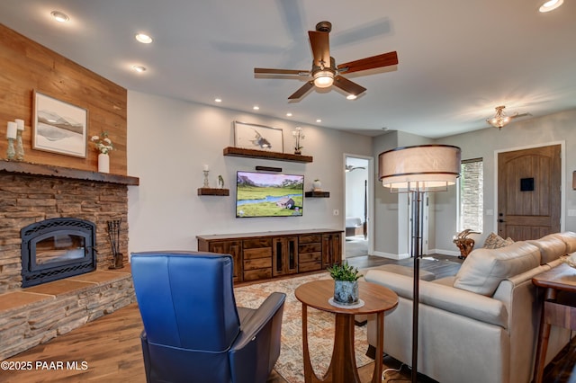 9150 N Whitney Way, Prescott Valley, AZ 86315 - living area featuring ceiling fan, wood finished floors, recessed lighting, a stone fireplace, and baseboards