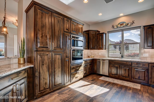 9150 N Whitney Way, Prescott Valley, AZ 86315 - kitchen featuring appliances with stainless steel finishes, a sink, dark wood finished floors, tasteful backsplash, and recessed lighting