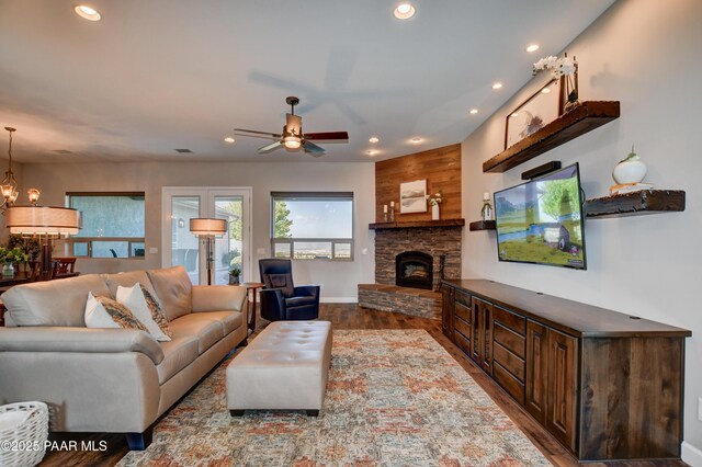 9150 N Whitney Way, Prescott Valley, AZ 86315 - living room with recessed lighting, wood finished floors, ceiling fan, a chandelier, and a stone fireplace