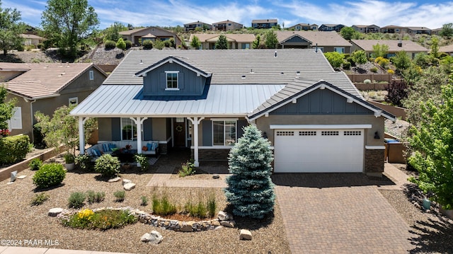 view of front of home featuring a garage and covered porch