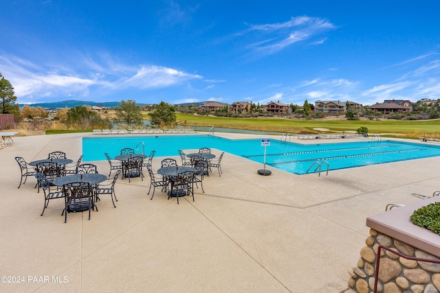 view of swimming pool with a patio