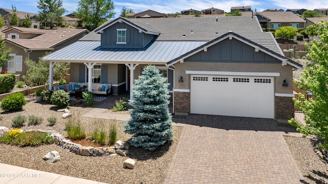 view of front of house with a porch and a garage