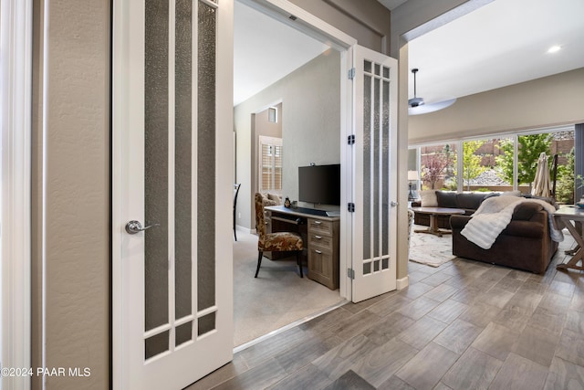 hallway featuring french doors and hardwood / wood-style flooring