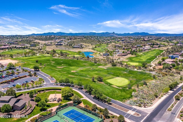 drone / aerial view featuring a water and mountain view