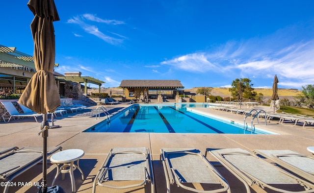 view of swimming pool featuring a patio area