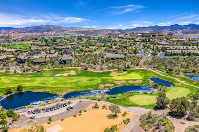 birds eye view of property featuring a water and mountain view