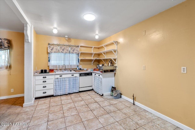 2403 Country Park Dr, Prescott, AZ 86305 - kitchen with white dishwasher, white cabinetry, open shelves, light countertops, and light tile patterned floors