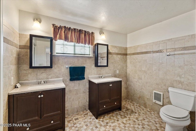 2403 Country Park Dr, Prescott, AZ 86305 - bathroom with tile walls, heating unit, and two vanities