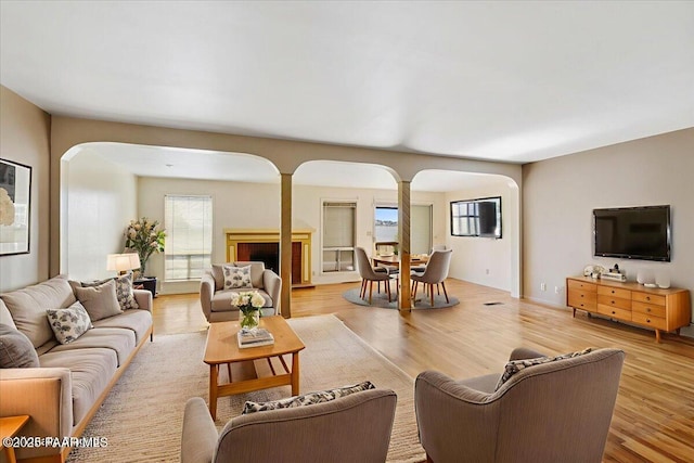 2403 Country Park Dr, Prescott, AZ 86305 - living area with arched walkways and light wood finished floors