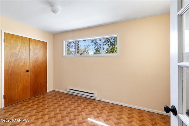 2403 Country Park Dr, Prescott, AZ 86305 - unfurnished bedroom featuring baseboard heating and a closet
