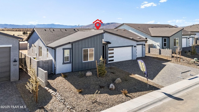 view of front of home featuring a garage and a mountain view