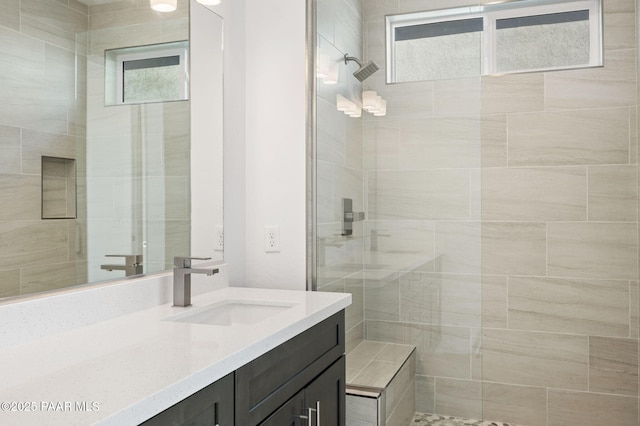 bathroom featuring vanity and walk in shower