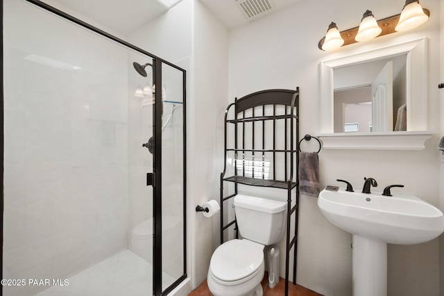 full bathroom with toilet, visible vents, and a stall shower