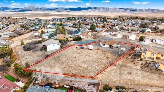 bird's eye view featuring a residential view and a mountain view