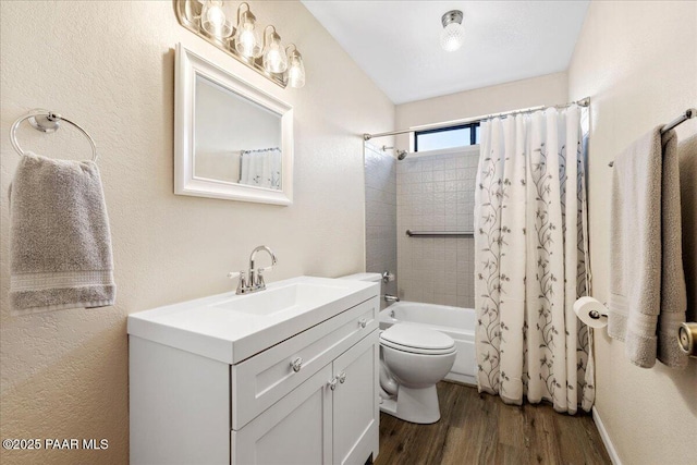 full bathroom featuring toilet, vanity, wood finished floors, and shower / bath combo with shower curtain