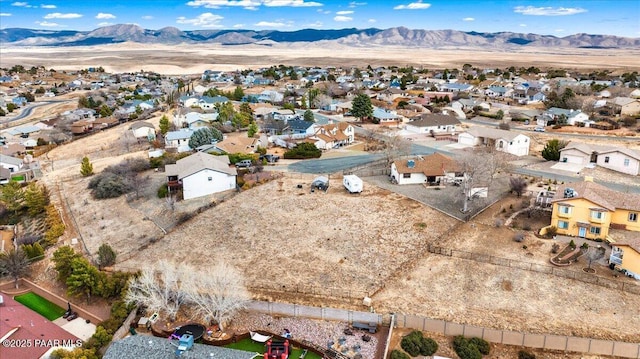 birds eye view of property with a residential view and a mountain view