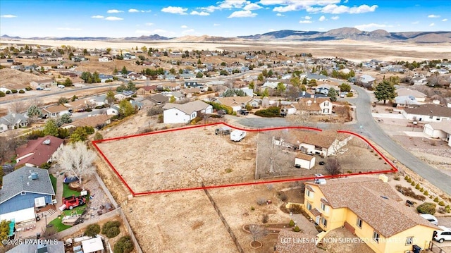 bird's eye view with a residential view and a mountain view