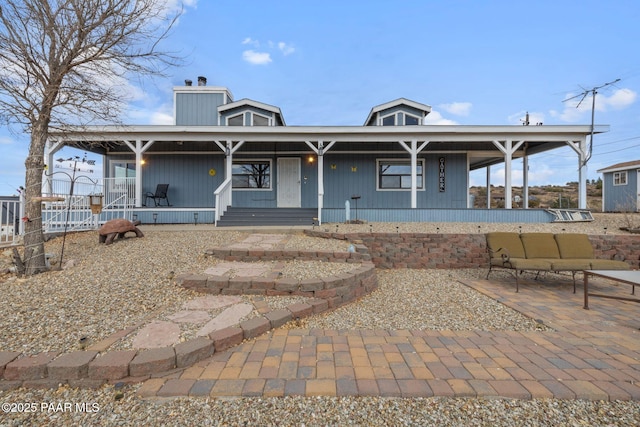 view of front facade with a porch and a patio