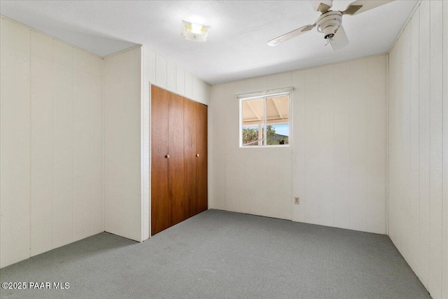 1485 S Pima Rd, Dewey-Humboldt, AZ 86327 - unfurnished bedroom with carpet floors, ceiling fan, and a closet