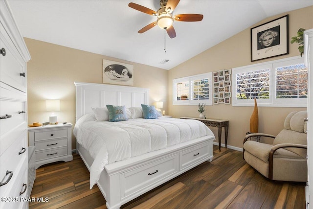 bedroom with multiple windows, ceiling fan, dark hardwood / wood-style flooring, and vaulted ceiling